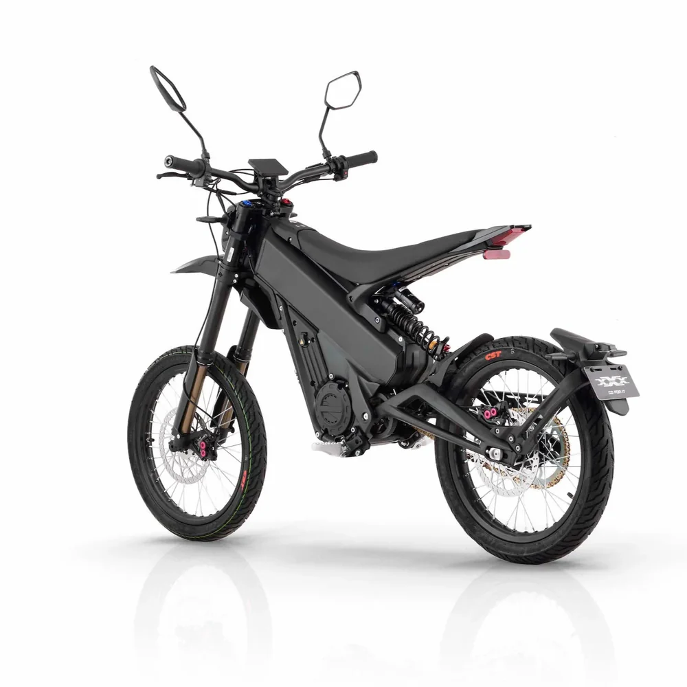 Talaria X3 Pro 5kw Electric Bike transitioning from urban street to a light off-road trail in Europe.