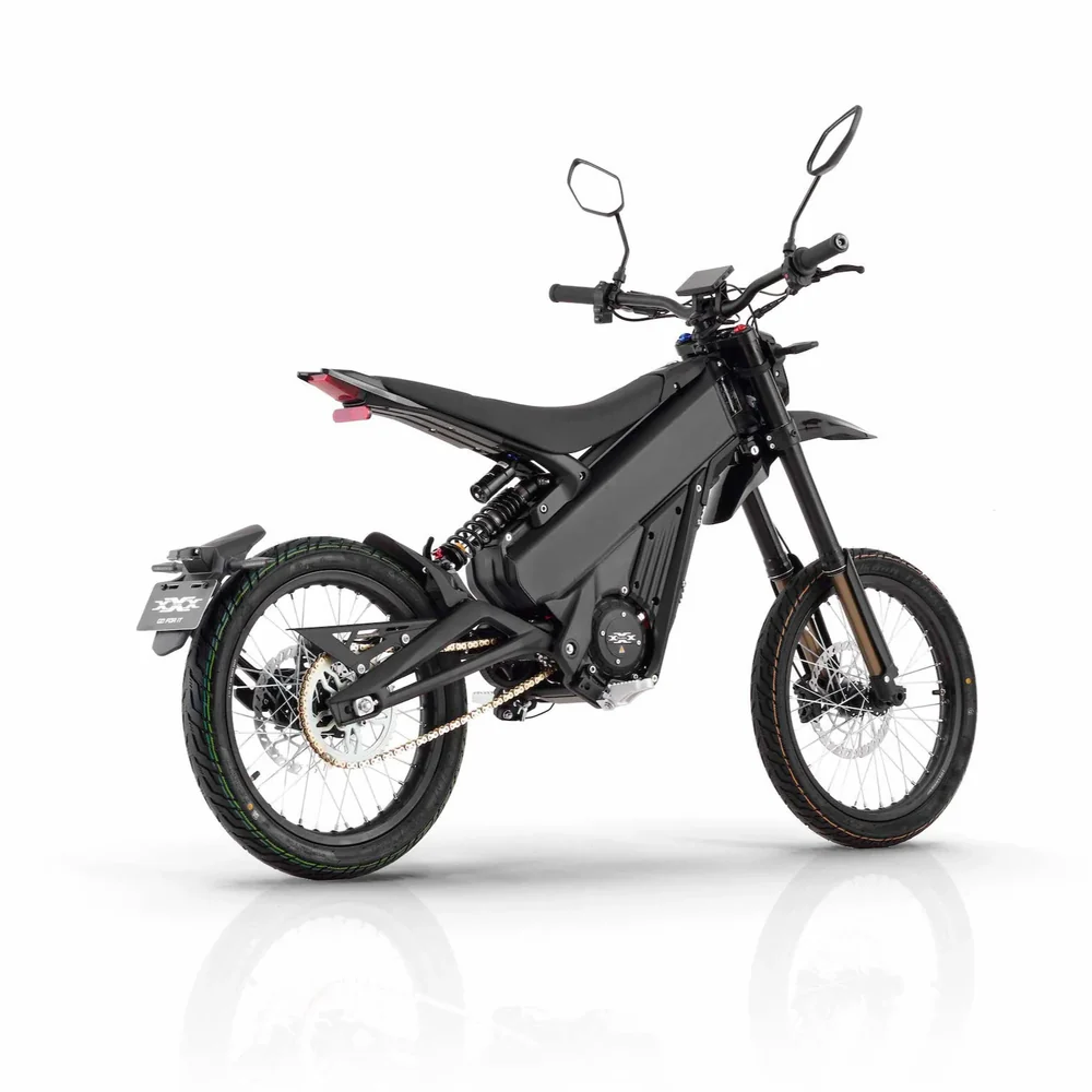 Talaria X3 Pro 5kw Electric Bike transitioning from urban street to a light off-road trail in Europe.
