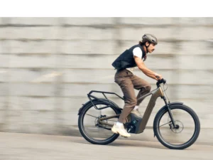 The 2026 Riese & Müller Delite5 GT Rohloff HS electric bike in Amber, featuring full suspension, Bosch ABS, Rohloff E-14 electronic shifting, a 1050Wh dual-battery system, and an off-road kit with a luggage rack for premium European trekking.