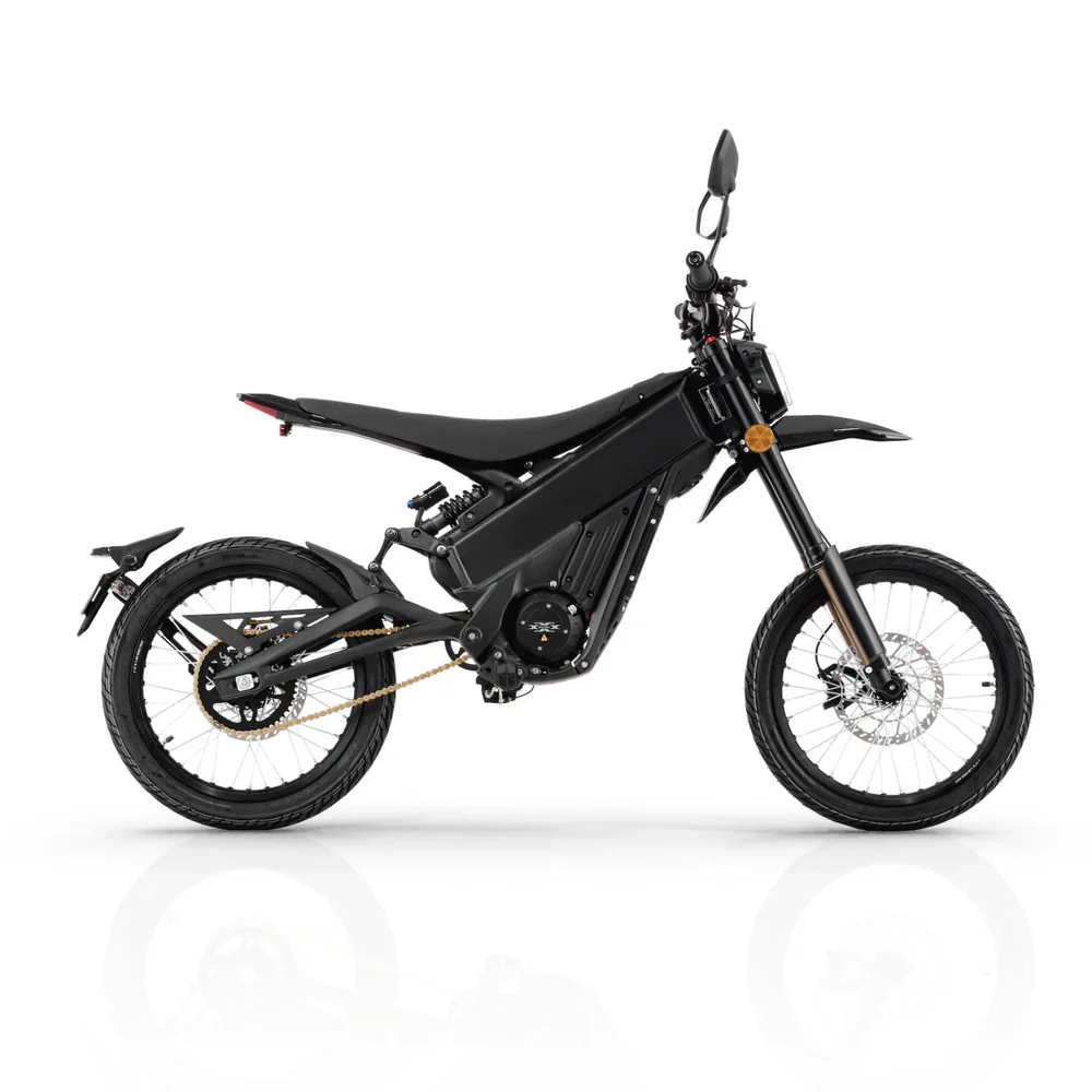 Talaria X3 Pro 5kw Electric Bike transitioning from urban street to a light off-road trail in Europe.