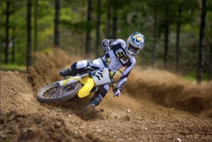 Sur Ron Storm Bee electric dirt bike in motion on a forest trail, rider leaning into a turn, dust kicking up. Dynamic off-road action shot. • Title: Sur Ron Storm Bee Off-Road Performance 